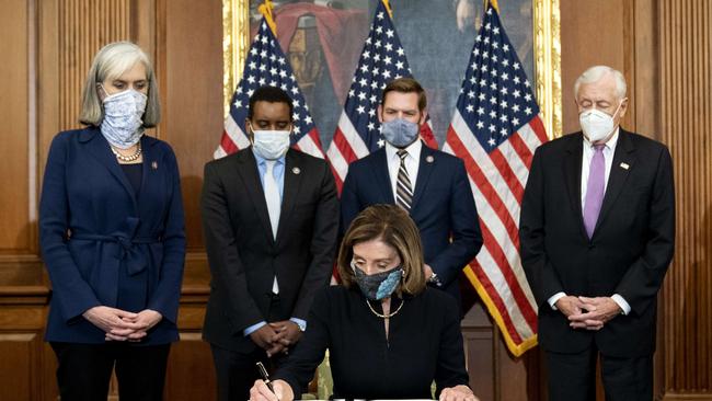 Speaker of the House Nancy Pelosi (D-CA) signs an article of impeachment against President Donald Trump at the U.S. Capitol on January 13. Picture: AFP