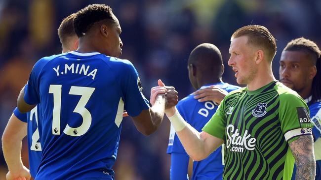 WOLVERHAMPTON, ENGLAND - MAY 20: Yerry Mina embraces Jordan Pickford of Everton after the draw during the Premier League match between Wolverhampton Wanderers and Everton FC at Molineux on May 20, 2023 in Wolverhampton, England. (Photo by Shaun Botterill/Getty Images)