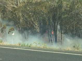 A grass fire near the Sandy Creek Bridge has forced the closure of the westbound lanes of the Warrego Highway.