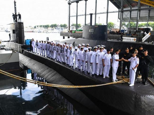 This handout from the Indonesia military taken on February 20, 2019 and released on April 21, 2021 shows the crew and officers during a ceremony onboard the Indonesian Cakra class submarine KRI Nanggala at the naval base in Surabaya. - Indonesia's military said it was searching for the submarine with 53 crew aboard after losing contact with the vessel during naval exercises off the coast of Bali on April 21, 2021. (Photo by HANDOUT / INDONESIA MILITARY / AFP) / -----EDITORS NOTE --- RESTRICTED TO EDITORIAL USE - MANDATORY CREDIT "AFP PHOTO / INDONESIA MILITARY" - NO MARKETING - NO ADVERTISING CAMPAIGNS - DISTRIBUTED AS A SERVICE TO CLIENTS