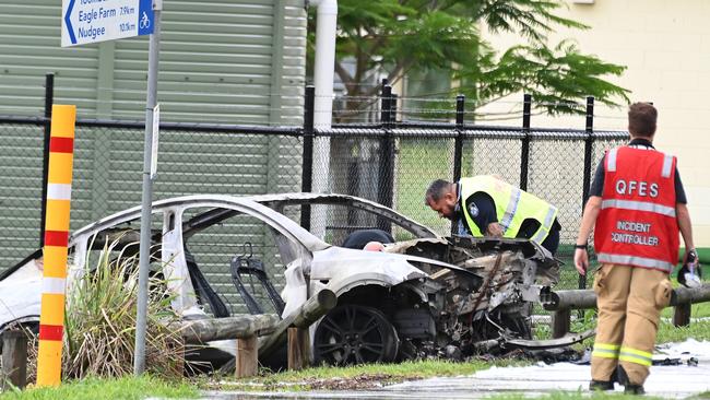 A Tesla driver and his teenage passenger were injured after the car slammed into a pole and caught fire in Brisbane's north on Saturday November 30. Picture, John Gass