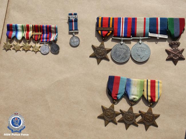 These war medals were allegedly uncovered during the raids. Picture: NSW Police