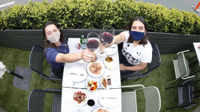 Diners Milly Middleton and Clementine Donohoe testing out the new outdoor dining concept for Melbourne cafes and restaurants. Picture: David Caird