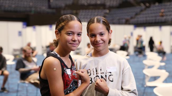 12 year old twins Shiloh and Sienna Nakachi of Kanimbla took the opportunity to get vaccinated against the Covid-19 coronavirus at the mass vaccination hub set up in the Cairns Convention Centre. Picture: Brendan Radke