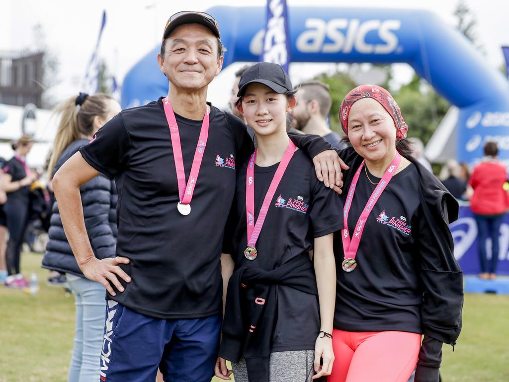 Brisbane family Martin Hen, Sabrina Hen and Louisa Hen. at the finish the Gold Coast Airport Fun Run. Picture: Tim Marsden.