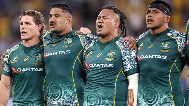 Wallabies players sing the national anthem on Saturday night. Picture: Getty Images