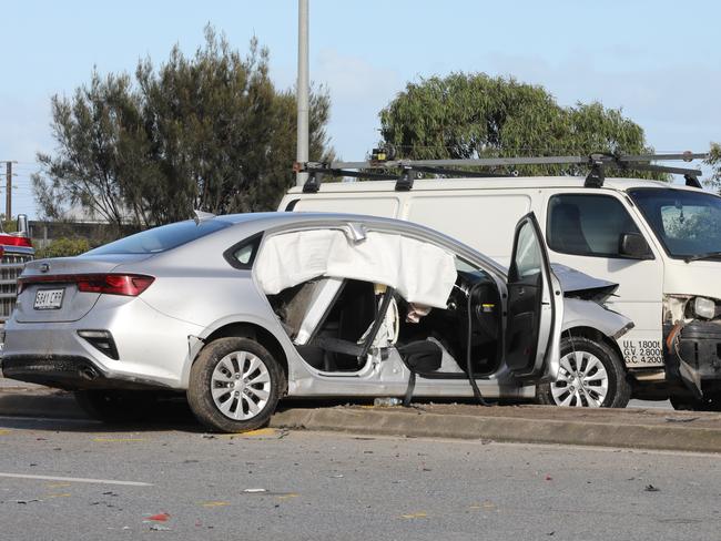 On the Port River Expressway, a woman has died and three other people have been taken to hospital following a crash at Gillman last night. Wreckage was strewn along about a 4oo metre stretch of road. The rear axle of the car that caused the accident, was ripped completely out. 2 November 2022. Picture Dean Martin