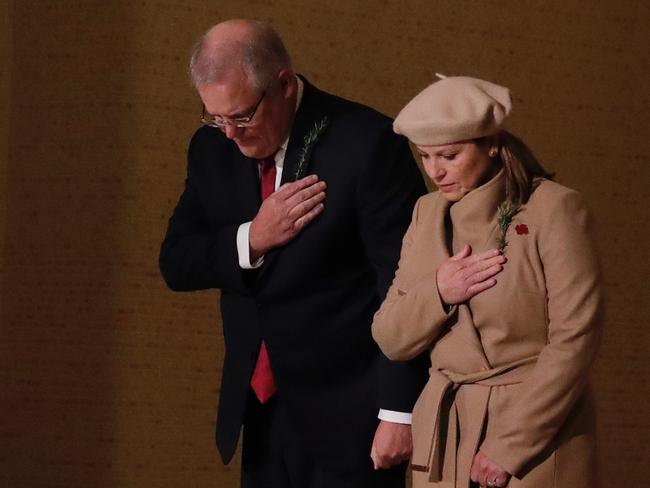 Prime Minister Scott Morrison and Jenny Morrison lay a wreath at the Tomb of the Unknown Australian Soldier during the Anzac Day commemorative service at the Australian War Memorial in Canberra, Saturday, April 25, 2019. Anzac Day is a national day of remembrance to commemorate the service and sacrifice of Australian and New Zealand service men and women. (AAP Image/Sydney Morning Herald Pool, Alex Ellinghausen) NO ARCHIVING