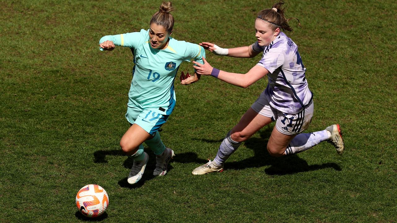 Matildas midfielder Katrina Gorry battles for possession with Emma Watson of Scotland. Picture: Getty Images