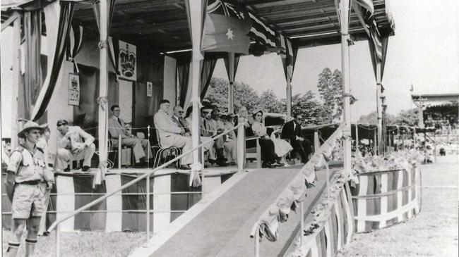 Queen Elizabeth II and the Duke Of Edinburgh, Prince Phillip, seated on the royal dais at the Mackay showgrounds in 1954.