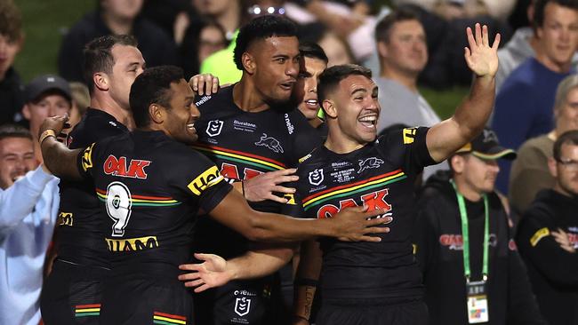 PENRITH, AUSTRALIA - MARCH 10:  Stephen Crichton of the Panthers celebrates with team mates after scoring a try, which was later disallowed by the video bunker during the round one NRL match between the Penrith Panthers and the Manly Sea Eagles at BlueBet Stadium on March 10, 2022, in Penrith, Australia. (Photo by Cameron Spencer/Getty Images)