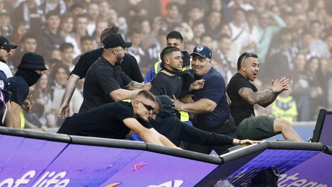 Fans storm the pitch in protest during the round eight A-League Men's match at AAMI Park last month. Photo: Darrian Traynor/Getty Images