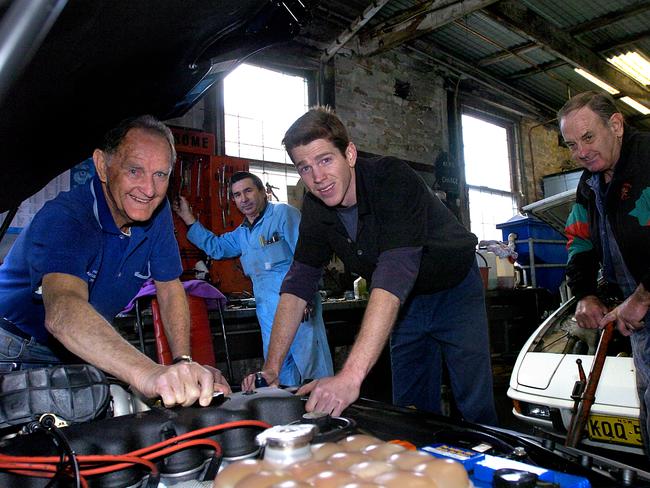 Phil O'Sullivan getting his hands dirty at his Denison St garage. The garage has been in the family for more than 90 years.