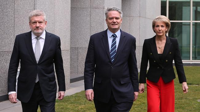 Mitch Fifield, Mathias Cormann and Michealia Cash. Picture: News Corp Australia