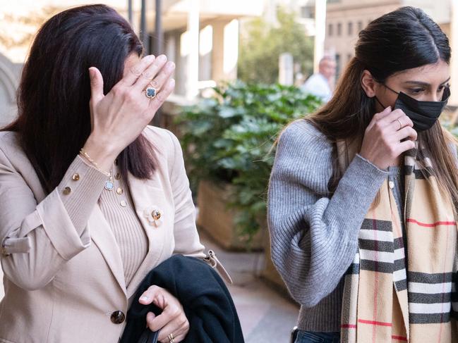 Cynthia Ballo and her mother hide their faces outside court. Picture: Flavio Brancaleone.