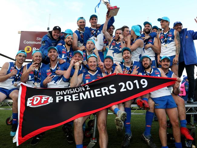 Sunbury Kangaroos show off the spoils of victory on Saturday. Picture: Mark Dadswell