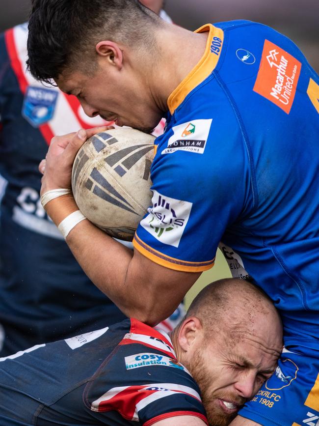 Bradley Speechley’s crunching tackle on Kangaroo Dylan Nunes. News Local, Pictures by Julian Andrews.