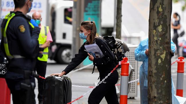 Tennis players, coaches and officials arrive at a hotel in Melbourne