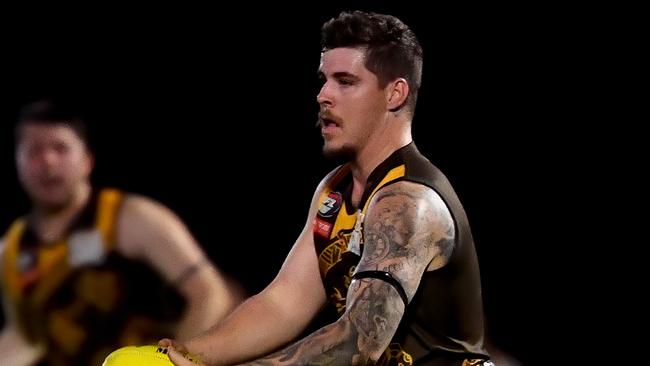 Lachlan Evans of Heidelberg West runs with the ball during the round two NFNL 2023 Heidelberg Golf Club Division 3 Seniors match between Heidelberg West and Fitzroy Stars at Heidelberg Park in Heidelberg, Victoria on April 21, 2023.