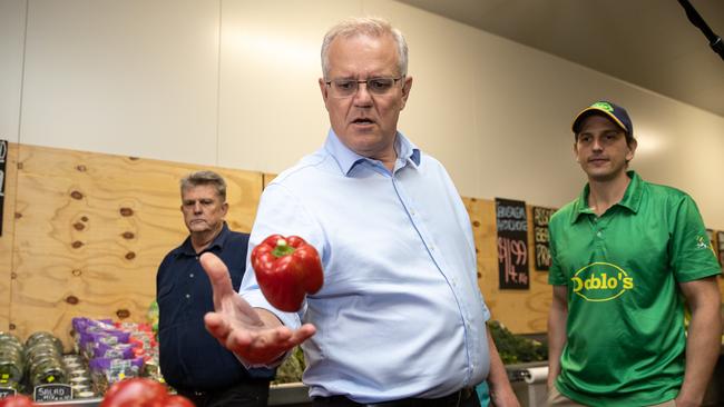 ELECTION TEAM 2022LIBERAL BUS TOUR 26/4/2022Prime Minister Scott Morrison visits DobloÃs Farmers Market to buy some locally grown fruits and vegetables in Rockhampton, QLD in the seat of Capricornia. ATTENDING:The Hon Scott Morrison MP, Prime MinisterThe Hon Michelle Landry MP, Assistant Minister for Children and Families; Assistant Minister for Regional TourismMr Dominic Doblo, Owner, DobloÃs Farmers Market Picture: Jason Edwards