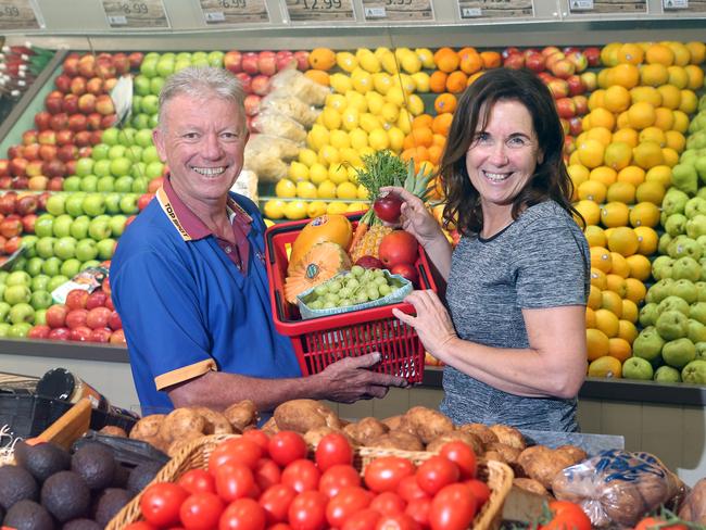 Your Local Fruit Shop retailer Barry Haskins with Lorrilee Blanning at Top Spot Fruit Mart. Picture by Richard Gosling