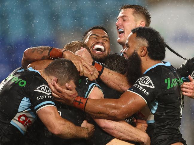 GOLD COAST, AUSTRALIA - MAY 22: Lachlan Miller of the Sharks celebrates a try during the round 11 NRL match between the Gold Coast Titans and the Cronulla Sharks at Cbus Super Stadium, on May 22, 2022, in Gold Coast, Australia. (Photo by Chris Hyde/Getty Images)