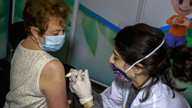 A health worker administers a dose of the Pfizer-BioNtech COVID-19 vaccine in Jerusalem on Sunday. Picture: AFP