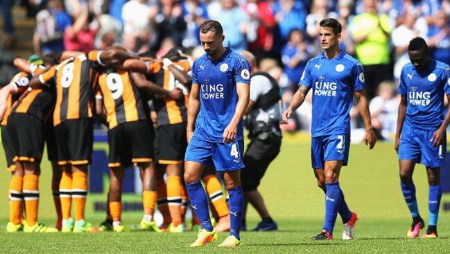 Leicester’s players trudge off the field as Hull celebrates.