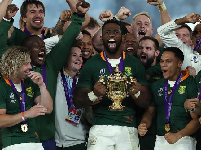 YOKOHAMA, JAPAN - NOVEMBER 02:  Siya Kolisi, the South Africa captain, raises the Webb Ellis Cup after their victory during the Rugby World Cup 2019 Final between England and South Africa at International Stadium Yokohama on November 02, 2019 in Yokohama, Kanagawa, Japan. (Photo by David Rogers/Getty Images)