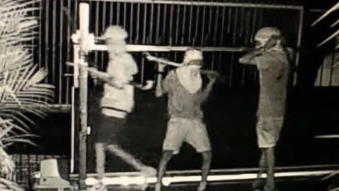 Several masked youths have been caught on a CCTV security system wandering around a suburban Marlow Lagoon backyard armed with makeshift weapons in the dead of night. Photo: Facebook