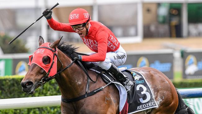 Jockey Kerrin McEvoy celebrates after steering Redzel to victory in last year’s The Everest. Picture: AAP