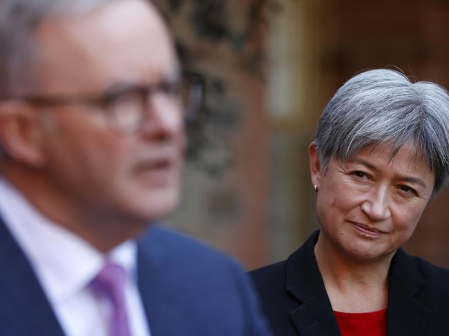 ADELAIDE, AUSTRALIA - MAY 20: Penny Wong listens to Labor Leader Anthony Albanese speak at a press conference during a visit to Cabra Dominican College on May 20, 2022 in Adelaide, Australia. The Australian federal election will be held on Saturday 21 May, 2022. (Photo by Lisa Maree Williams/Getty Images)