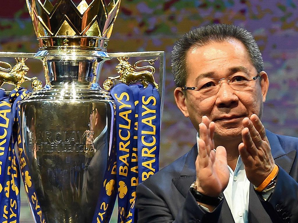 (FILES) In this file photo taken on May 18, 2016 Leicester City FC's owner Vichai Srivaddhanaprabha applauds as they take part in a presentation of the English Premier League football trophy at the King Power duty-free headquarters in Bangkok on May 18, 2016. - A helicopter belonging to Thai tycoon Vichai Srivaddhanaprabha crashed on October 27, 2018 near the stadium of his UK football club Leicester City. The identities of the pilot and any passengers on board have not yet been confirmed. It is also not yet known if anyone on the ground was injured. (Photo by CHRISTOPHE ARCHAMBAULT / AFP)