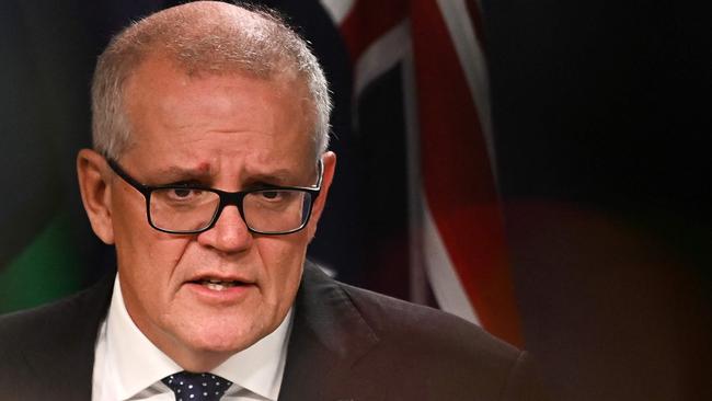 Australia's former prime minister Scott Morrison speaks to media during a press conference in Sydney on August 17, 2022. - Australia's Prime Minister Anthony Albanese on August 16 said that his predecessor Scott Morrison secretly seized control of five ministerial posts, labelling it an "unprecedented trashing of our democracy". (Photo by Steven Saphore / AFP)