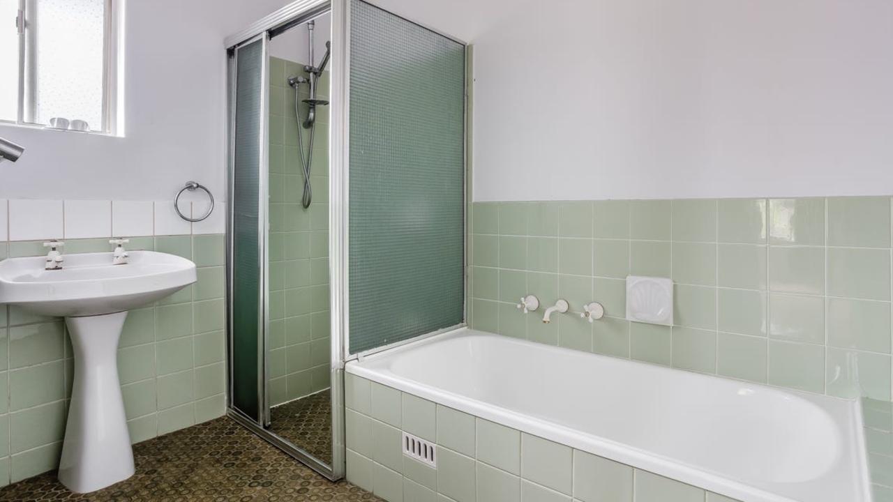 <b>RETRO GREEN: </b>It’s trendy to some but this bathroom is about to be freshened up. Picture: supplied