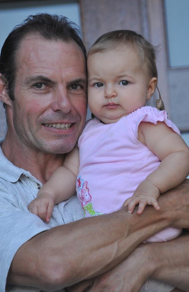 26/03/09 Glen Bell with his 10 month old daughter, Zuri, who is learning to hear with the help of the Hear and Say Centre. Picture - Warren Lynam. Sunshine Coast Daily.