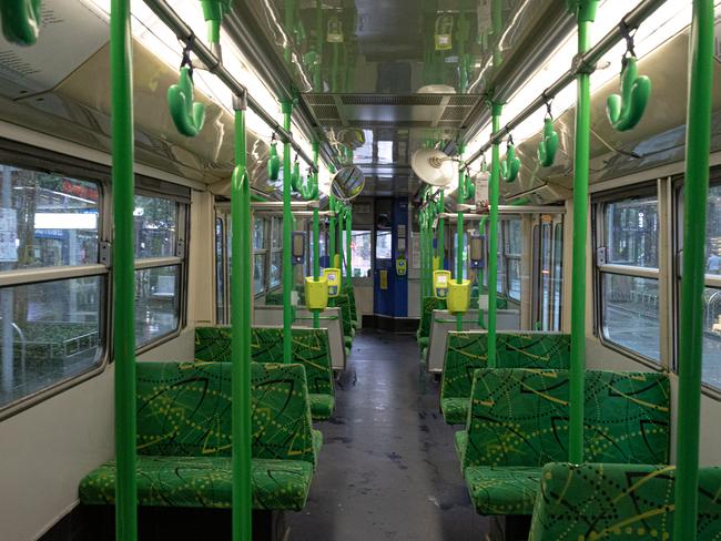 MELBOURNE, AUSTRALIA - MARCH 29: An empty tram travels down Swanston street on March 29, 2020 in Melbourne, Australia. All international arrivals into Australia from midnight on Saturday will be placed into mandatory quarantine in hotels for 14 days as the Federal Government increases restrictions to stop the spread of COVID-19.  All libraries, museums, galleries, beauty salons, tattoo parlours, shopping centre food courts, auctions, open houses, amusement parks, arcades, indoor and outdoor play centres, swimming pools are closed and indoor exercise activities are now banned. This is in addition to the closure of bars, pubs and nightclubs which came into effect on Monday. Restaurants and cafes are restricted to providing takeaway only. Weddings will now be restricted to five people including the couple while funerals are limited to 10 mourners. All Australians are now expected to stay at home except for essential outings such as work, grocery shopping and medical appointments. Exercising outdoors alone is still permitted. Australia now has more than 3,600 confirmed cases of COVID-19 while the death toll now stands at 16. (Photo by Asanka Ratnayake/Getty Images)