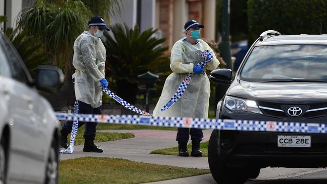 Police cordon off the house where the mother of two infected removalists became the fifth person to die in this outbreak. Picture: Joel Carrett