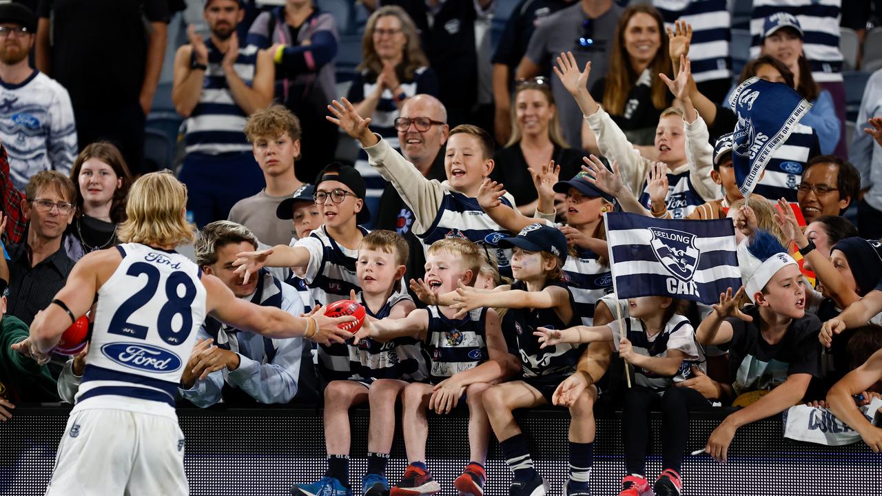 Oliver Dempsey greets Cats fans. Picture: Michael Willson/AFL Photos via Getty Images