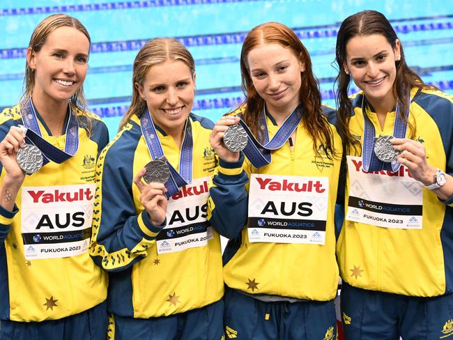 (L-R) Silver medallists Australia's Emma McKeon, Australia's Abbey Harkin, Australia's Mollie O'Callaghan and Australia's Kaylee McKeown pose during the medals ceremony for the women's 4x100m medley relay swimming event during the World Aquatics Championships in Fukuoka on July 30, 2023. (Photo by Yuichi YAMAZAKI / AFP)