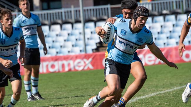 A Shark evades Parramatta’s defence. Picture: Monique Harmer