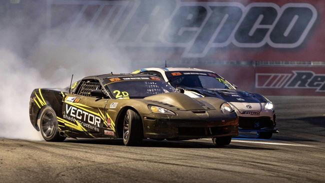 Patrick Barlee (grey Corvette) and Saxon drifting around a corner at the Gold Coast 500 Boost Mobile Pro Drift Slam, 2024. Picture: James Forester.