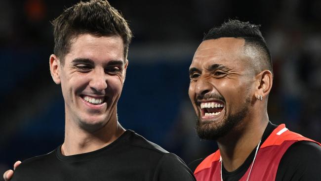 MELBOURNE, AUSTRALIA - JANUARY 29: Thanasi Kokkinakis (L) of Australia and Nick Kyrgios of Australia pose with the championship trophy after winning their Men's DoublesÃÂ Final match against Matthew Ebden of Australia and Max Purcell of Australia during day 13 of the 2022 Australian Open at Melbourne Park on January 29, 2022 in Melbourne, Australia. (Photo by Quinn Rooney/Getty Images)