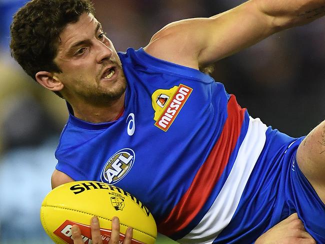 Tom Liberatore of the Bulldogs is seen in action during the Round 13 AFL match between the Western Bulldogs and the Melbourne Demons at Etihad Stadium in Melbourne, Sunday, June 18, 2017. (AAP Image/Julian Smith) NO ARCHIVING, EDITORIAL USE ONLY