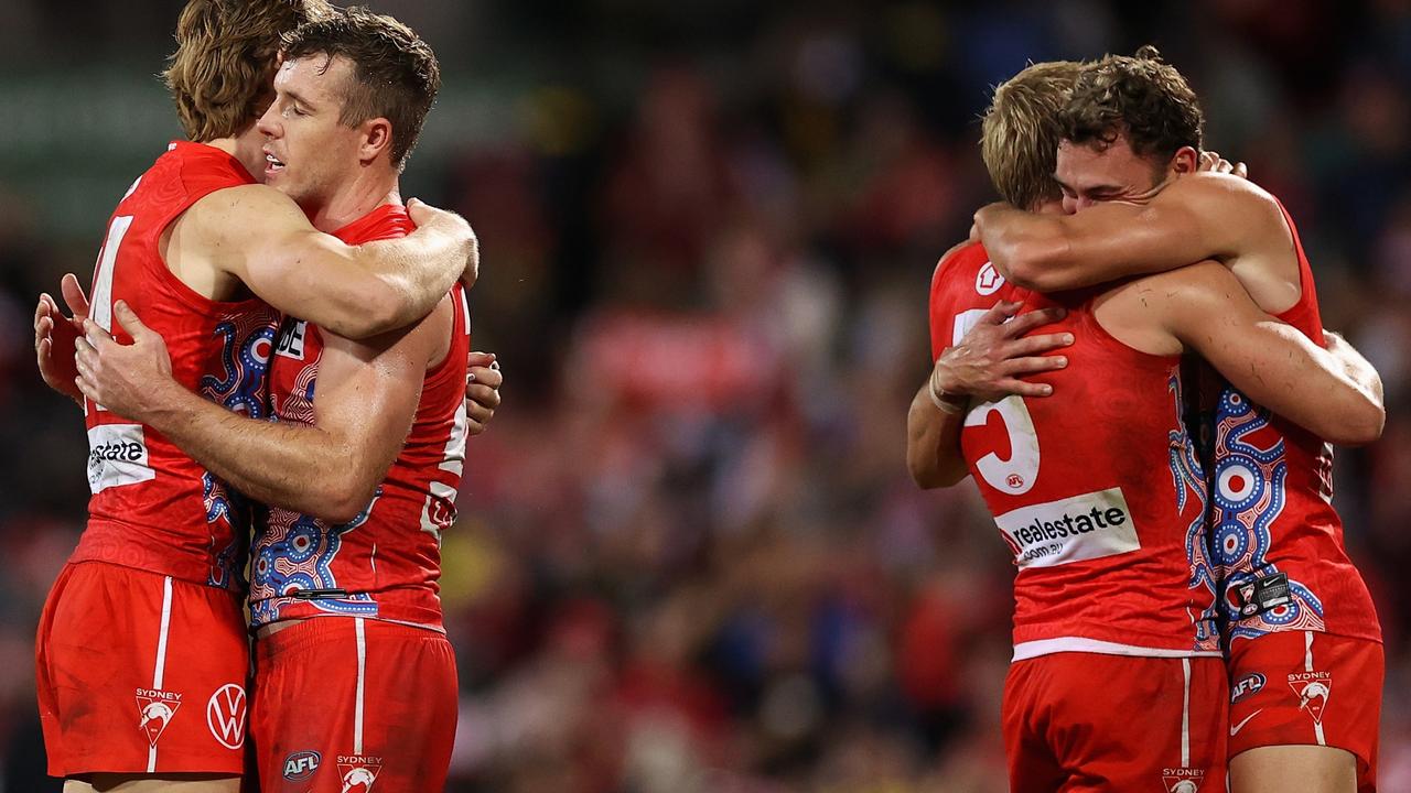 Sydney Swans players celebrate after they claim victory in controversial circumstances. Picture: Cameron Spencer/AFL Photos/via Getty Images
