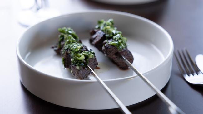 The wagyu tail skewers with native spice and spring onion salsa. Picture: David Kelly