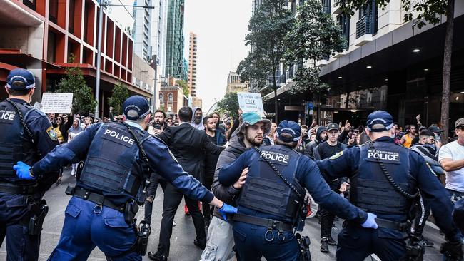 Police try to steer protesters away during a protest to rally for freedom of speech, movement, choice, assembly in Sydney. Picture: NCA NewsWire/Flavio Brancaleone