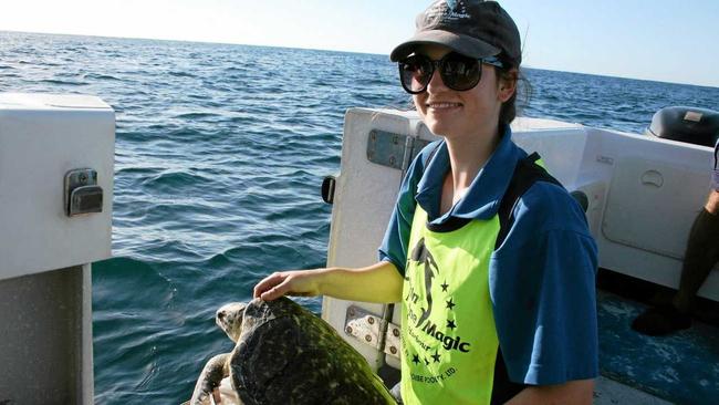 RARE TURTLE: Merri Pedler, a Batchelor of Science student from Flinders University in Adelaide currently Volunteering at DMM. Picture: Dolphin Marine Magic