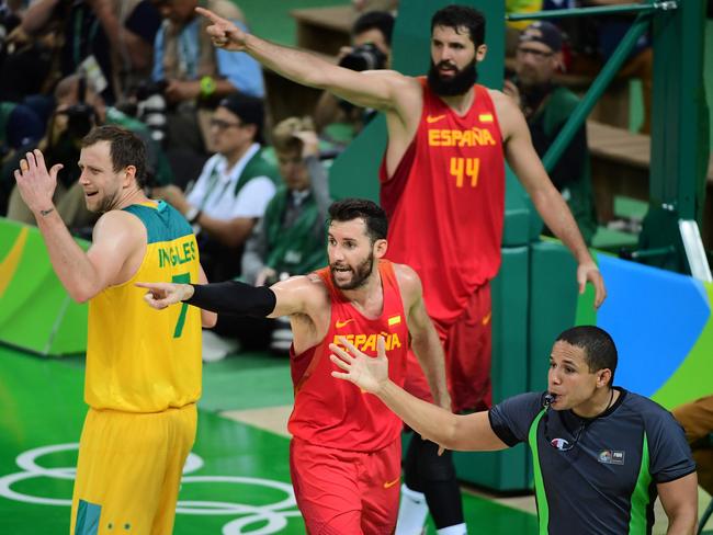 Australia's small forward Joe Ingles, Spain's small forward Rudy Fernandez and Spain's power forward Nikola Mirotic. Picture: Emmanuel Dunand