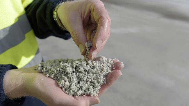 An employee holds processed lithium at Greenbushes. Picture: Carla Gottgens/Bloomberg